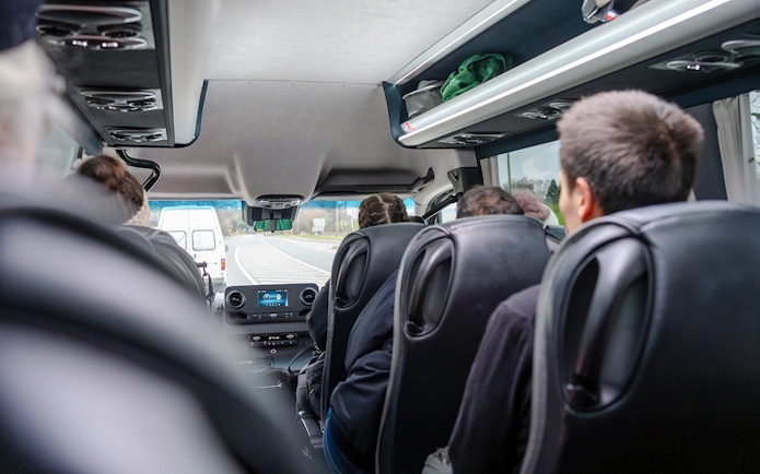 Minivan interior during Komani Lake and Shala River tour transfer from Tirana.