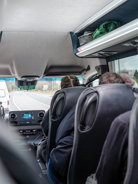 Minivan interior during Komani Lake and Shala River tour transfer from Tirana.