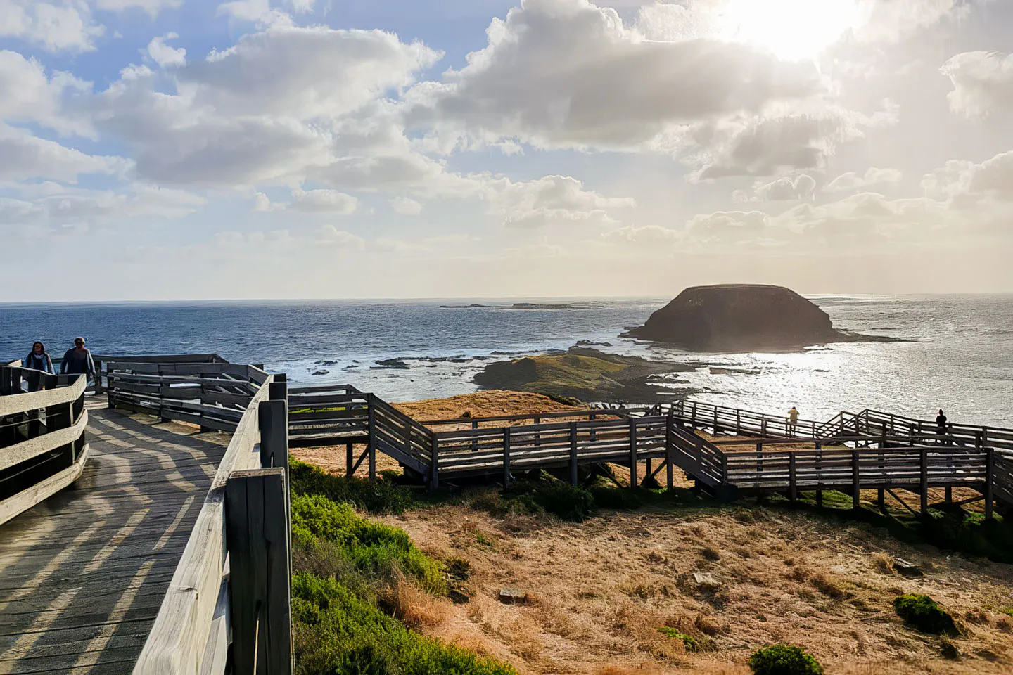 Wooden boardwalk overlooking ocean at Phillip Island Penguin Parade, Australia.