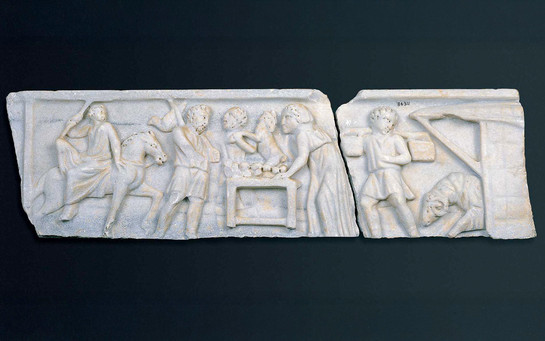 Early Christian marble sarcophagus fragment depicting biblical scenes with figures and animals.