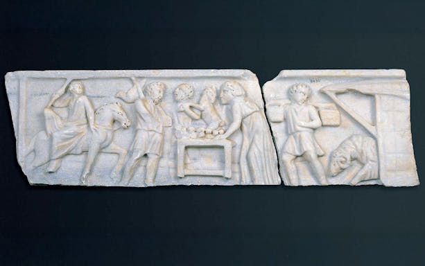 Early Christian marble sarcophagus fragment depicting biblical scenes with figures and animals.