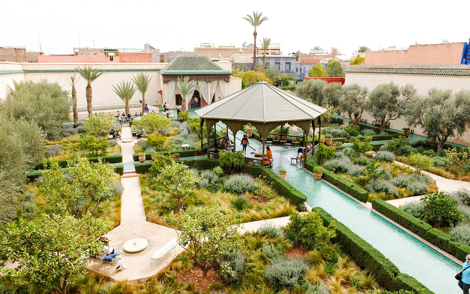 Jardin Secret in Marrakech, Morocco, featuring lush gardens, pathways, and a central pavilion.