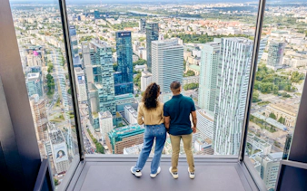 Couple enjoying panoramic view from Highline Warsaw terrace.