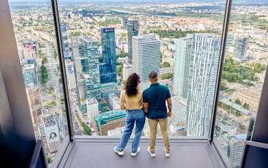 Couple enjoying panoramic view from Highline Warsaw terrace.