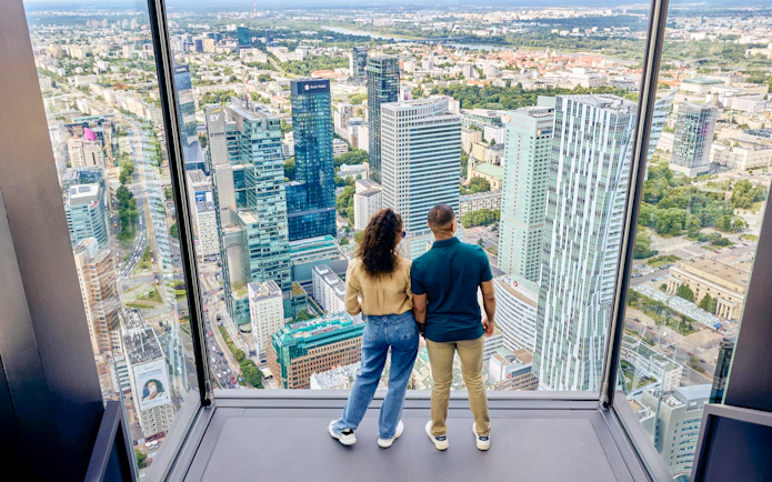 Couple enjoying panoramic view from Highline Warsaw terrace.