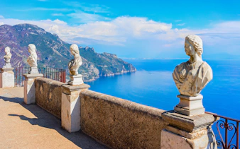 Terrace with marble statues overlooking the Amalfi Coast in Ravello, Italy.