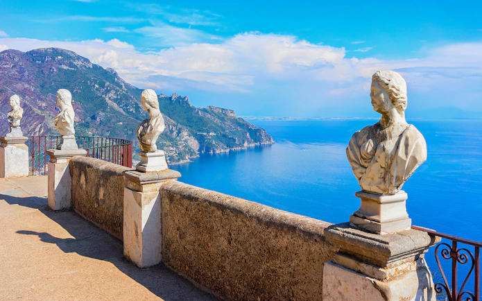 Terrace with marble statues overlooking the Amalfi Coast in Ravello, Italy.