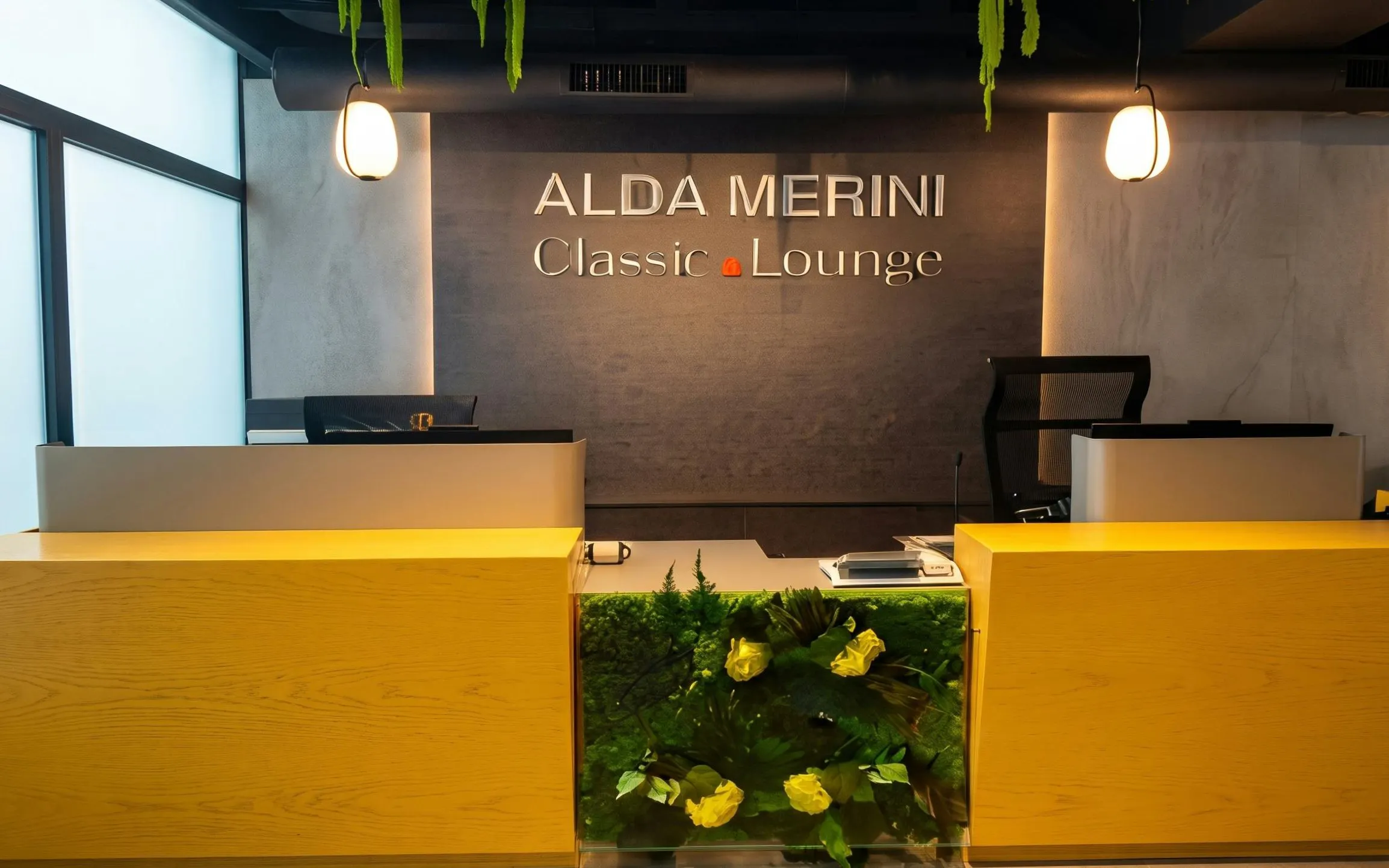 Alda Merini Classic Lounge reception desk at Malpensa Airport Terminal 2, Milan.