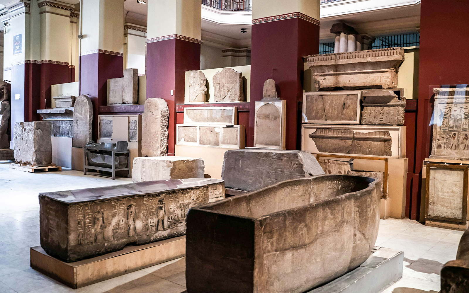 Artifacts and sarcophagi displayed in the Grand Egyptian Museum.