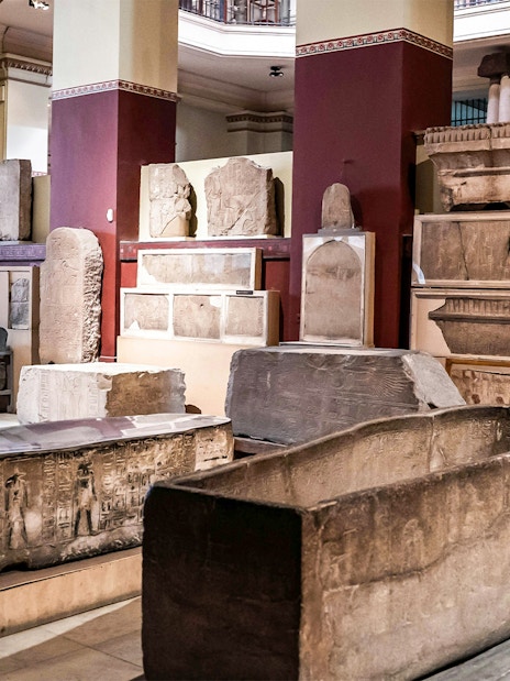 Artifacts and sarcophagi displayed in the Grand Egyptian Museum.