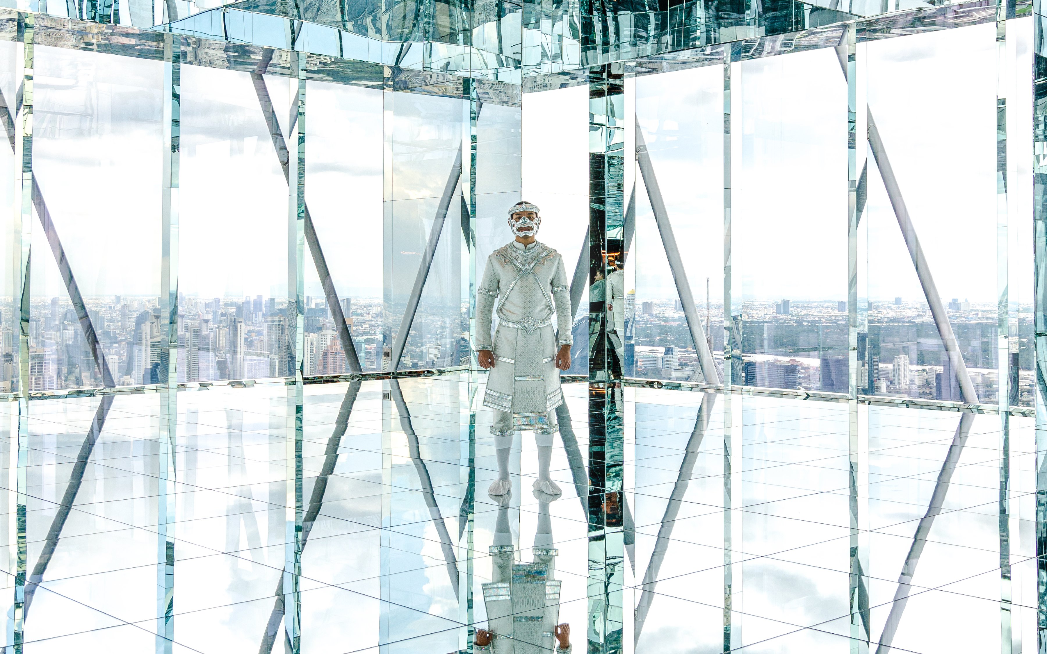 Reflection in mirrored observatory at Akara Sky Hanuman, Bangkok, Thailand.