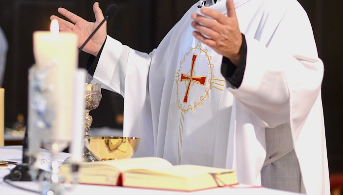 Chanting congregation inside Notre Dame Cathedral, Paris.