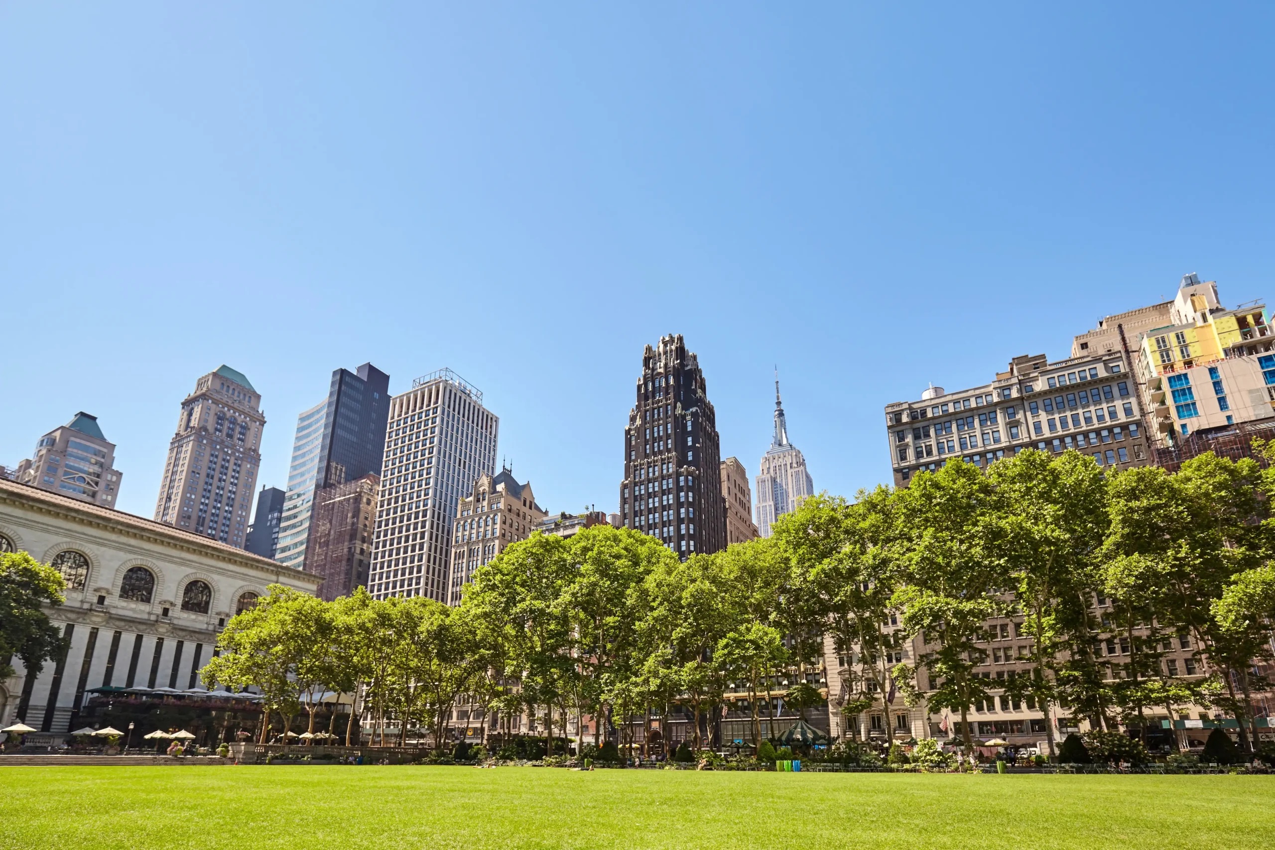 Bryant Park with New York City skyline in the background.