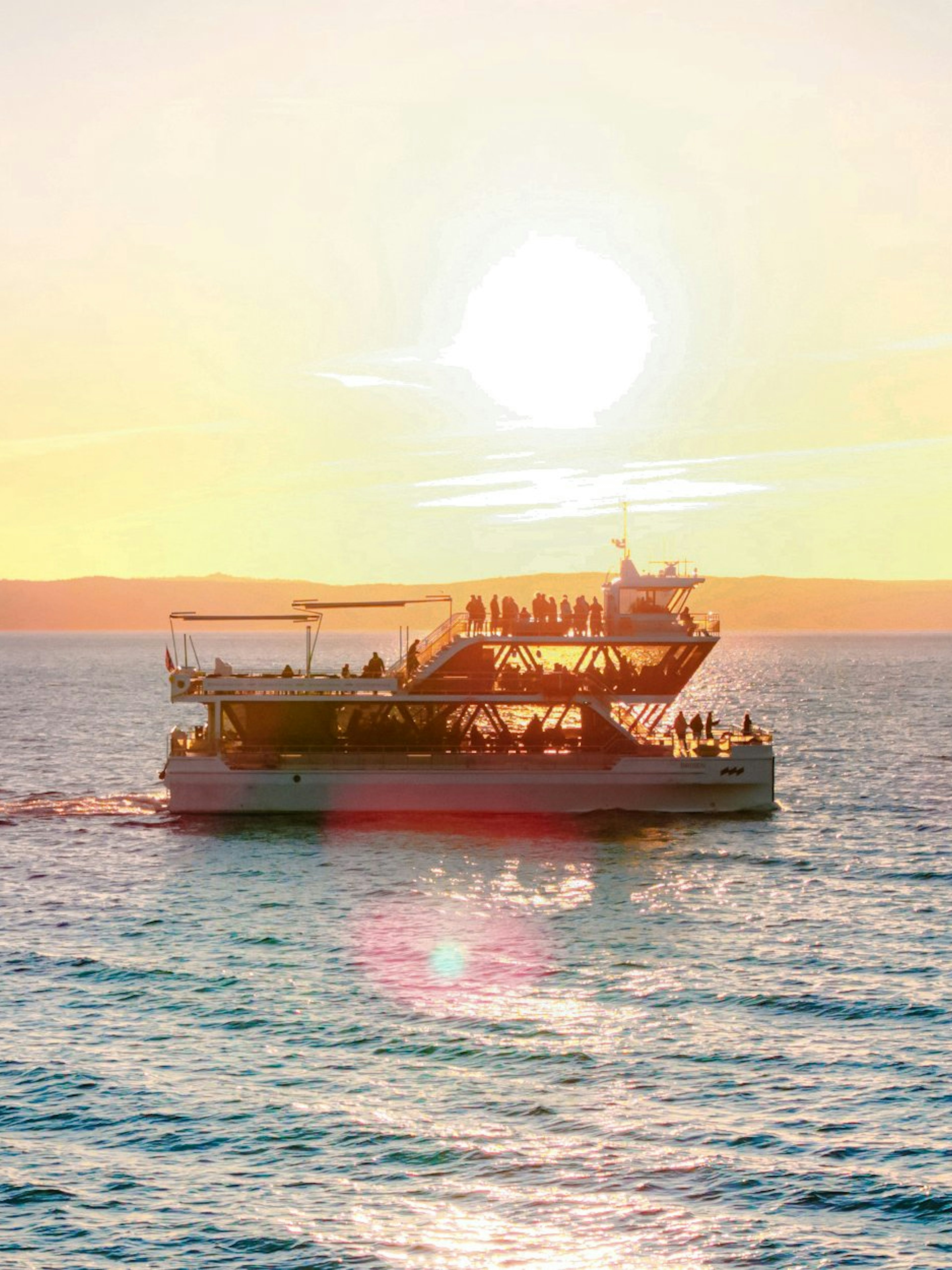 Dinner cruise boat sailing at sunset near Stavanger.
