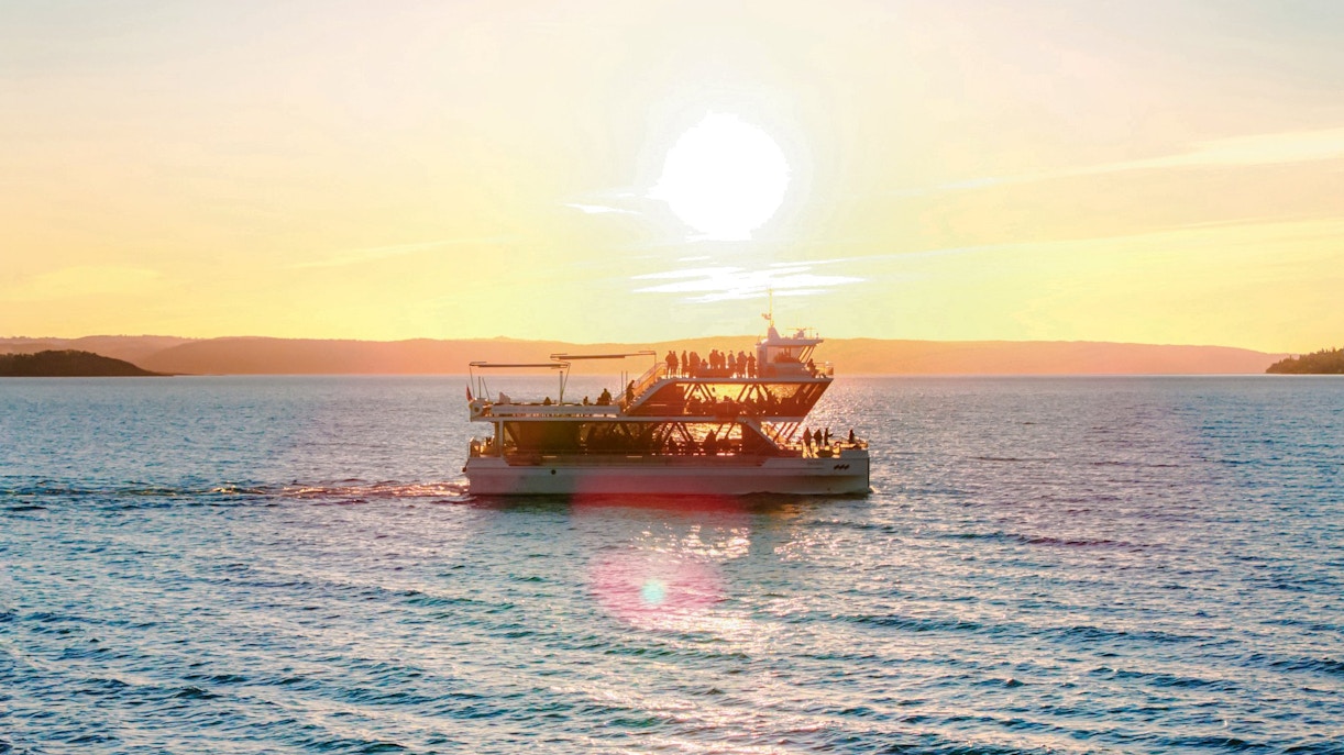 Dinner cruise boat sailing at sunset near Stavanger.
