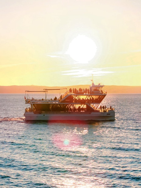 Dinner cruise boat sailing at sunset near Stavanger.