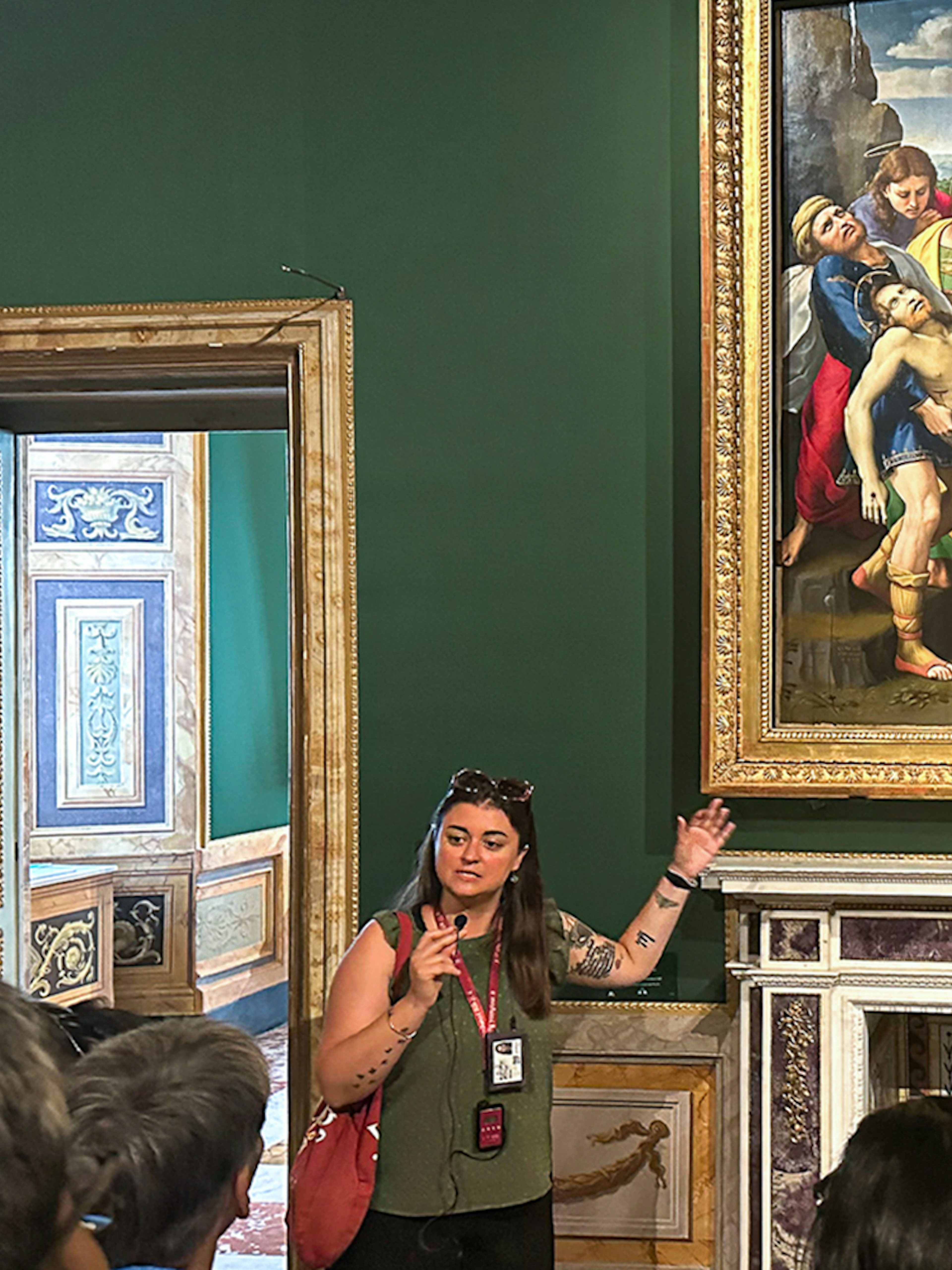 Tour guide explaining "The Deposition" by Raphael at Borghese Gallery, Rome.