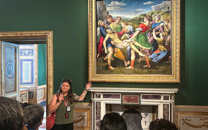 Tour guide explaining "The Deposition" by Raphael at Borghese Gallery, Rome.