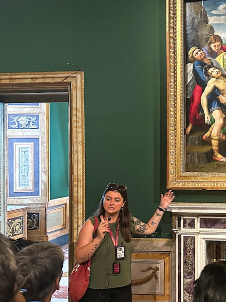Tour guide explaining "The Deposition" by Raphael at Borghese Gallery, Rome.