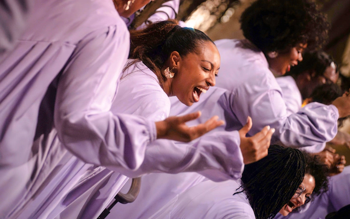 Choir singing passionately at Gospel Dream Concert, American Cathedral, Paris.