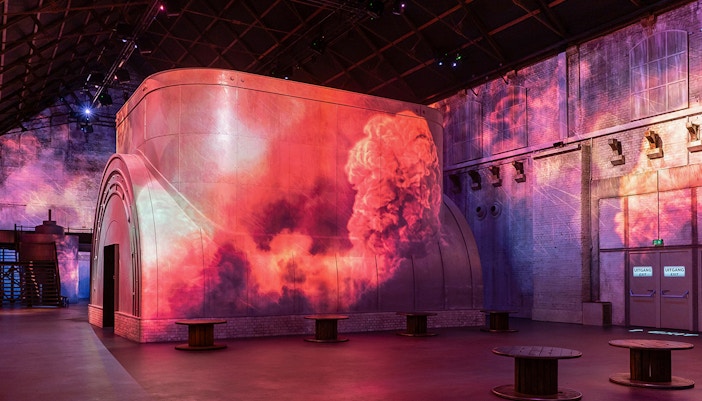 Fabrique des Lumières exhibit with cosmic projections on walls, Amsterdam.