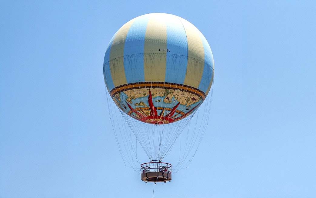 Hot air balloon in clear sky, part of Combo: Hot Air Balloon + Isla Mágica Tickets.