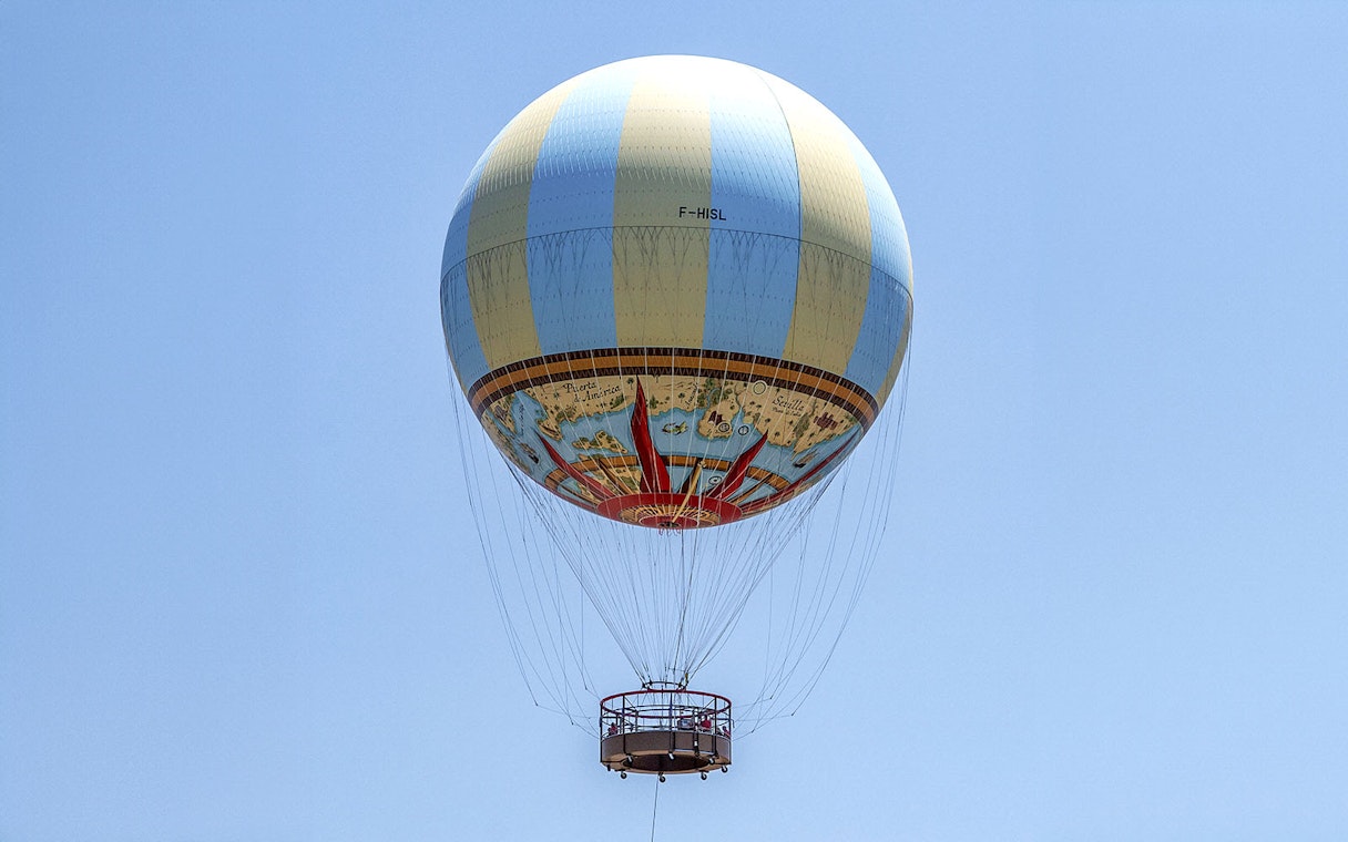 Hot air balloon in clear sky, part of Combo: Hot Air Balloon + Isla Mágica Tickets.