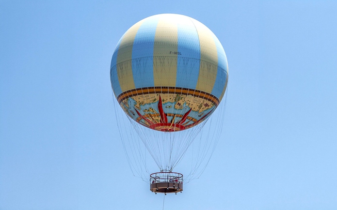 Hot air balloon in clear sky, part of Combo: Hot Air Balloon + Isla Mágica Tickets.