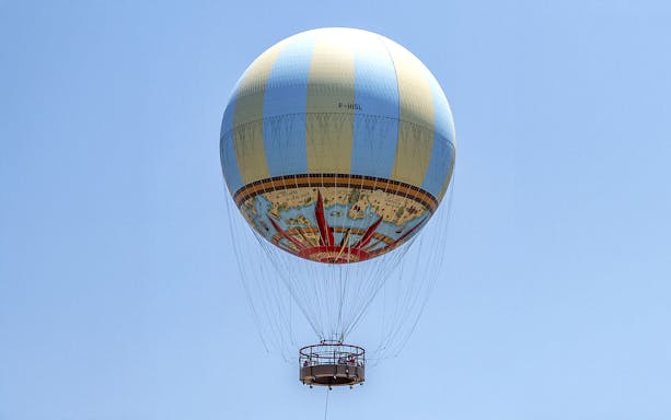 Hot air balloon in clear sky, part of Combo: Hot Air Balloon + Isla Mágica Tickets.