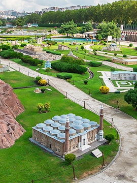 Miniature park with model of Selimiye Mosque in Istanbul, Turkey, surrounded by greenery and pathways.