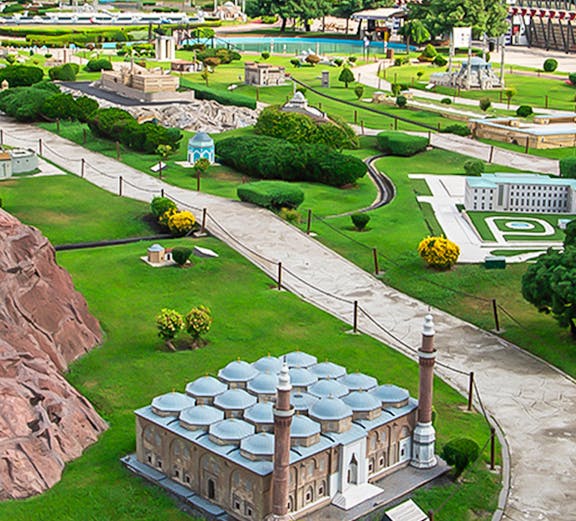 Miniature park with model of Selimiye Mosque in Istanbul, Turkey, surrounded by greenery and pathways.