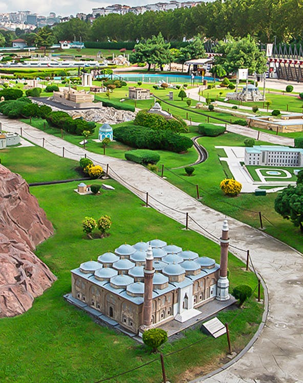 Miniature park with model of Selimiye Mosque in Istanbul, Turkey, surrounded by greenery and pathways.