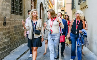 Visitors with a guide on a walking tour in Florence city center.