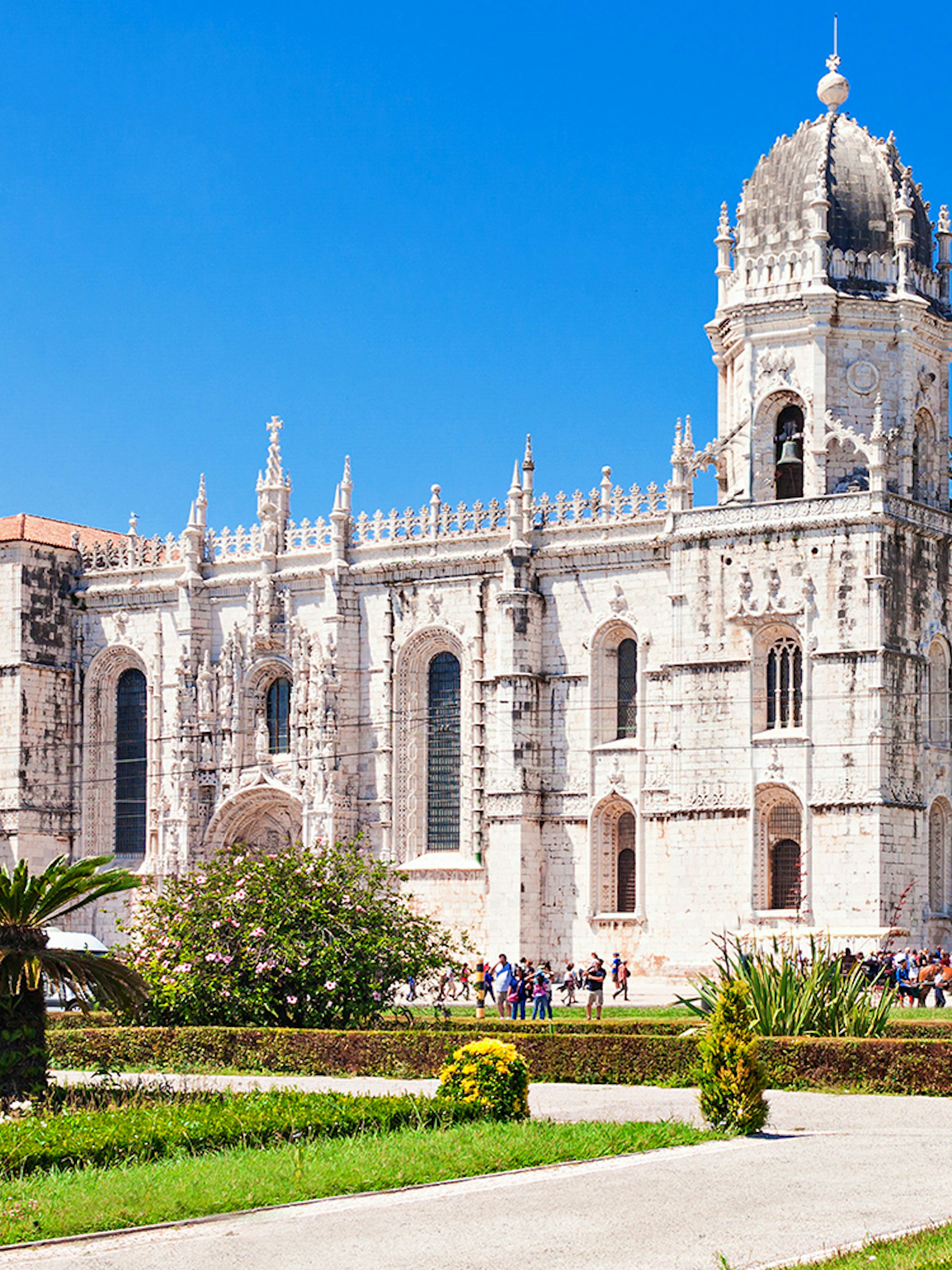 Jerónimos Monastery with ornate architecture and gardens in Lisbon, Portugal.