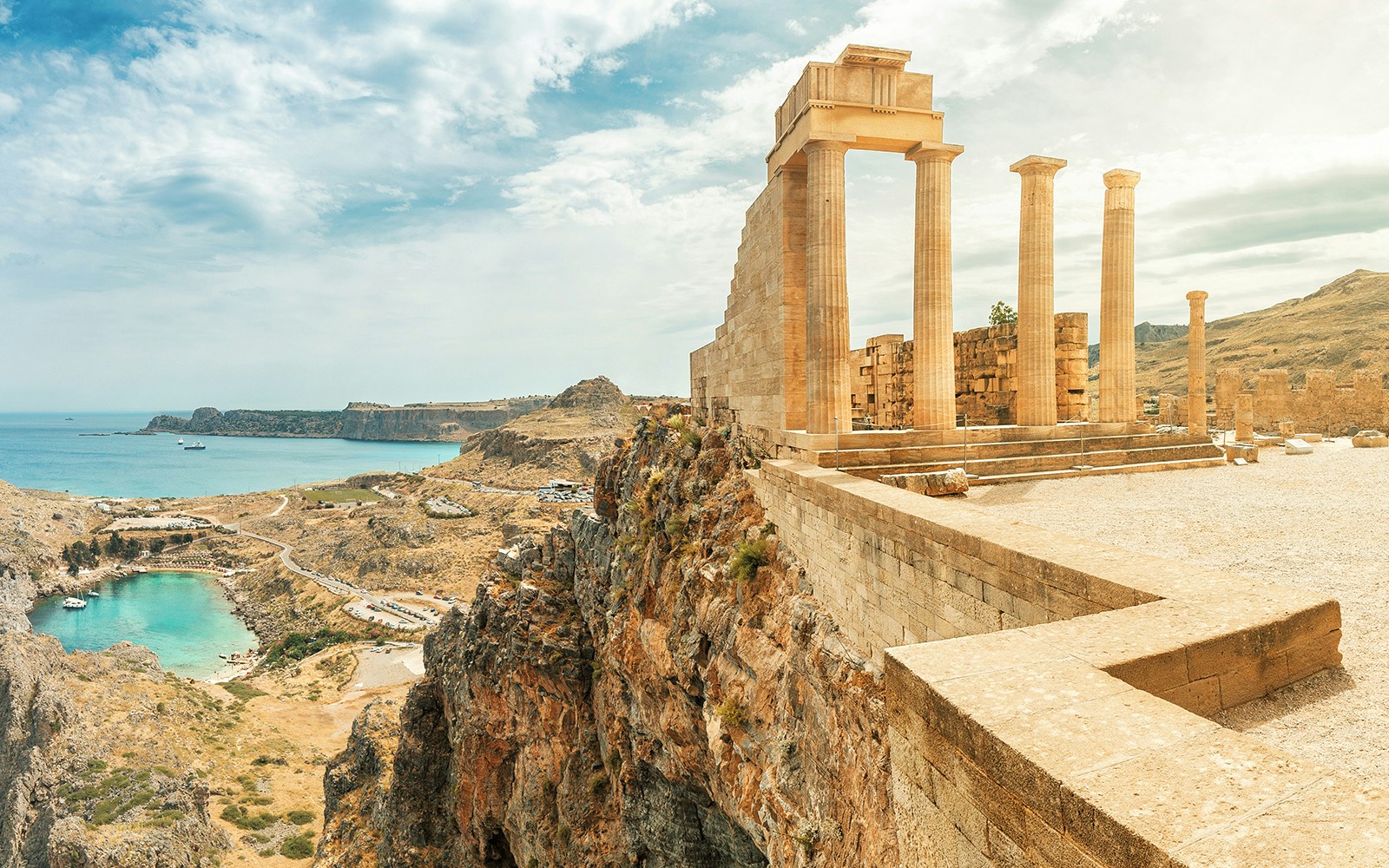 Acropolis of Lindos with ancient columns overlooking the Aegean Sea in Rhodes, Greece.