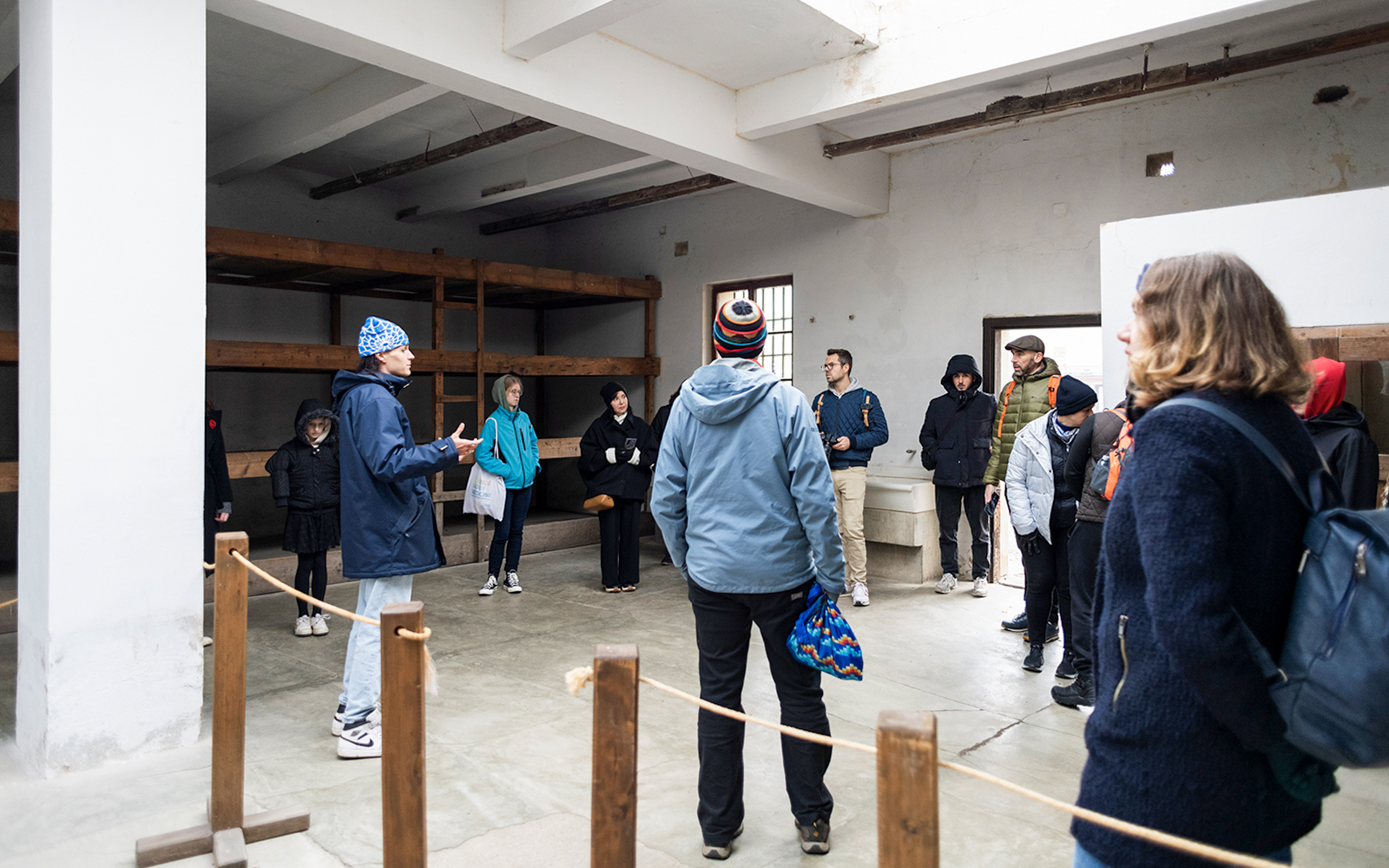 Guests touring a room inside Terezin Concentration Camp.