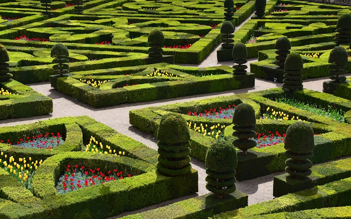 Villandry Gardens' intricate hedges and colorful flower beds in France.