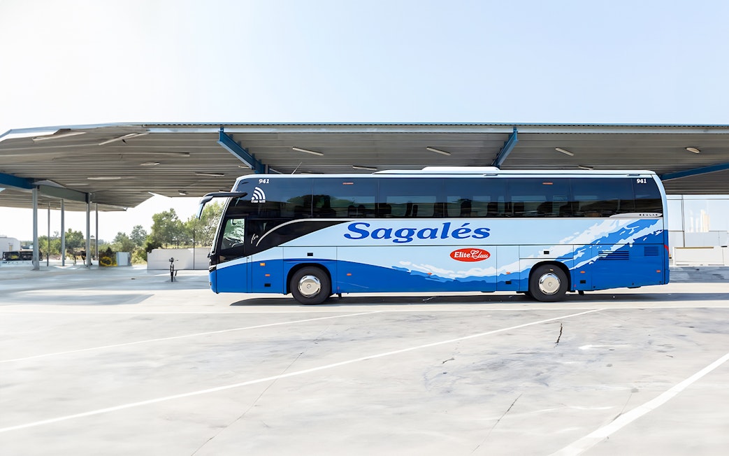 Bus at Girona Airport for transfer to Barcelona City Center.