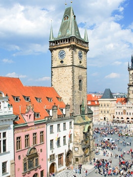 Prague Astronomical Tower with weekend crowd in Old Town Square.
