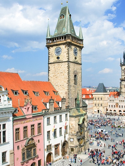 Prague Astronomical Tower with weekend crowd in Old Town Square.