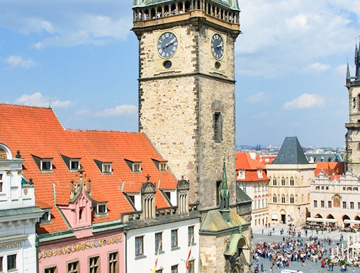 Prague Astronomical Tower with weekend crowd in Old Town Square.