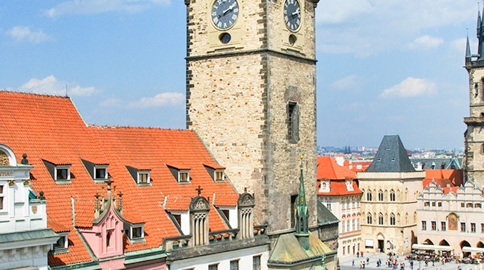 Prague Astronomical Tower with weekend crowd in Old Town Square.