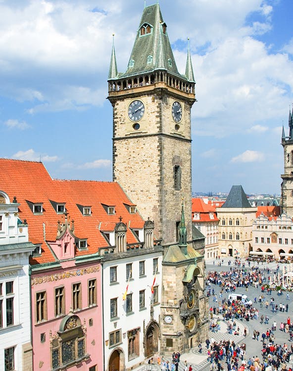 Prague Astronomical Tower with weekend crowd in Old Town Square.