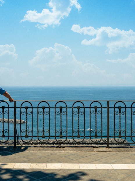 Couple admiring the Bay of Naples from a scenic overlook.
