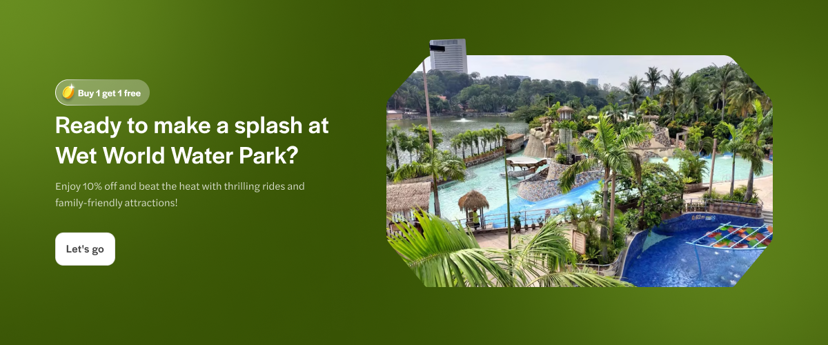 Wet World Water Park in Kuala Lumpur, Malaysia with pools and water slides surrounded by palm trees.