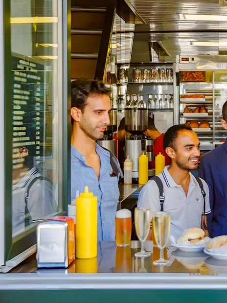 Tourist group with guide at a restaurant during Lisbon Food Walk in Baixa.