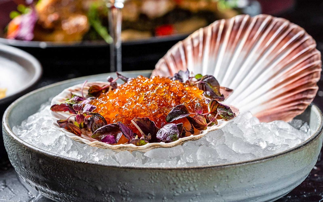 Scallop shell with caviar and greens on ice, CÉ LA VI Dubai lunch set menu.