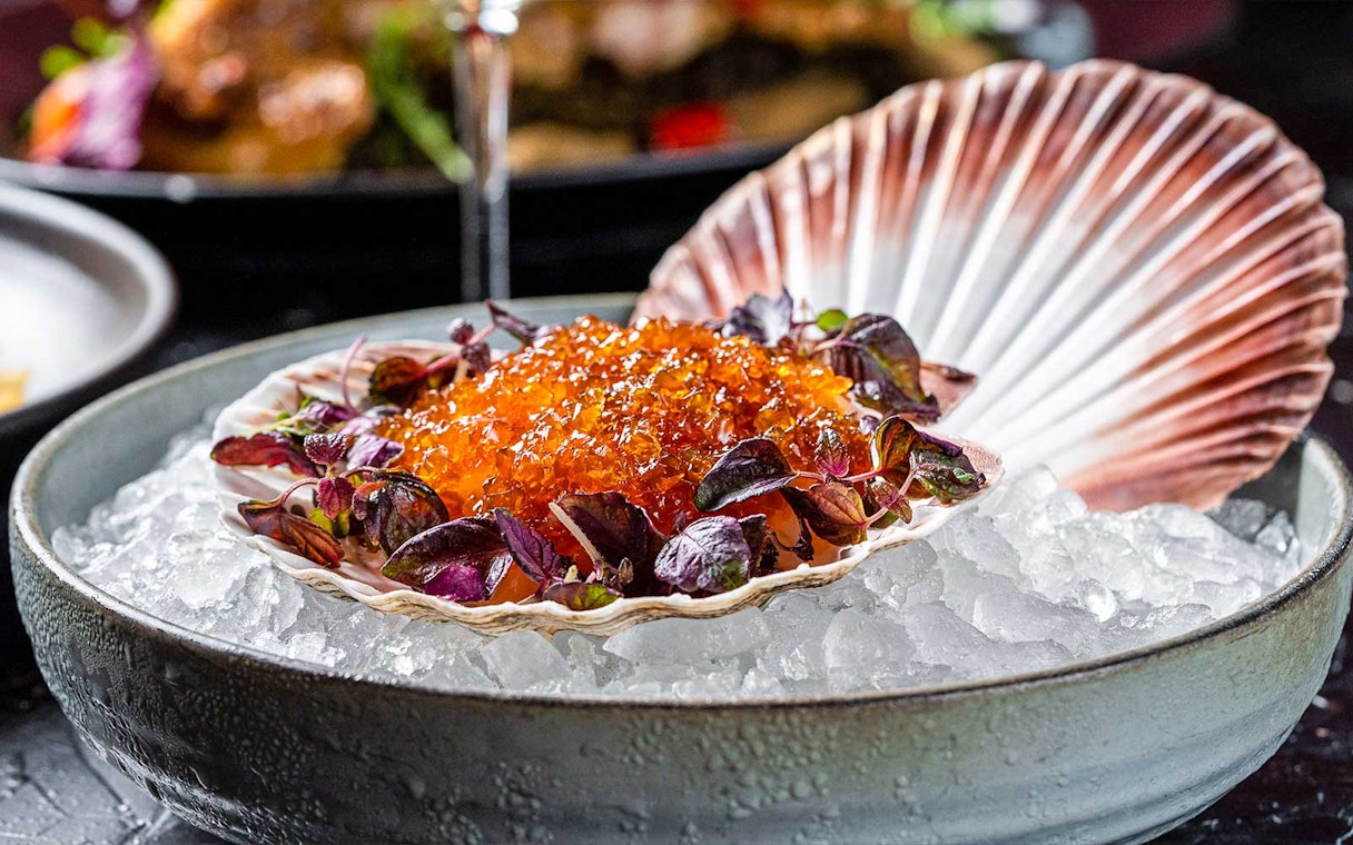 Scallop shell with caviar and greens on ice, CÉ LA VI Dubai lunch set menu.