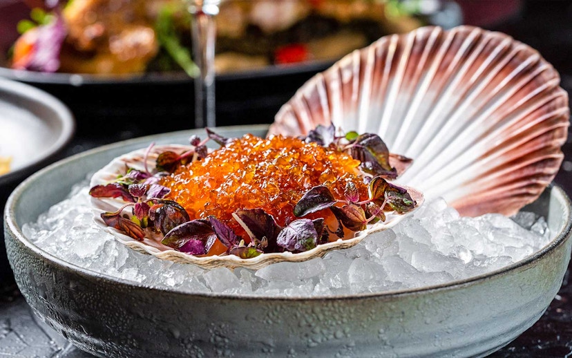 Scallop shell with caviar and greens on ice, CÉ LA VI Dubai lunch set menu.