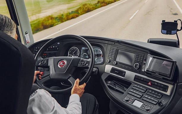 Driver's view from Alsa Granada Airport transfer bus dashboard on highway.